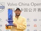 Alexander Levy celebrates with the trophy after winning the 2014 Volvo China Open on April 27, 2014