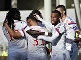 Lyon's French forward Alexandre Lacazette (R) celebrates with teammates after scoring during the French Ligue 1 football match against SC Bastia on April 27, 2014