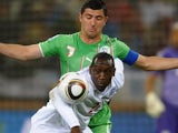 Algeria's Antar Yahia challenges England's Emile Heskey on June 18, 2010.