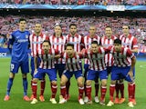 Atletico Madrid's starting eleven pose for a photo moments before kick-off against Chelsea during the Champions League semi-final first leg match on April 22, 2014