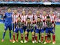 Atletico Madrid's starting eleven pose for a photo moments before kick-off against Chelsea during the Champions League semi-final first leg match on April 22, 2014