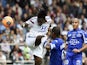 Lyon's French forward Bafetimbi Gomis (L) heads the ball and scores despite Bastia's Ivory Coast midfielder Romaric N Dri Koffi (C) and Bastia's Tunisian midfielder Wahbi Khazri during a match on April 27, 2014