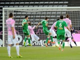 St Etienne's French midfielder Benjamin Corgnet (C) shoots and scores a goal during the French L1 football match between Evian (ETGFC) and Saint-Etienne (ASSE) on April 26, 2014