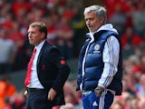 Manager Brendan Rodgers of Liverpool and Jose Mourinho manager of Chelsea look on from the touchline during the Barclays Premier League match on April 27, 2014