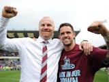 Burnley manager Sean Dyche celebrates with Danny Ings following the Sky Bet Championship match between Burnley and Wigan Athletic at Turf Moor on April 21, 2014