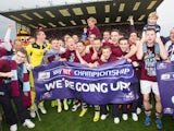 Burnley players celebrate promotion to the Premier League on April 21, 2014