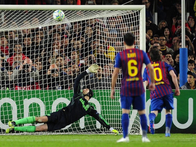 Barcelona's Argentinian forward Lionel Messi misses a penalty shot against Chelsea's Czech goalkeeper Petr Cech during the UEFA Champions League second leg semi-final football match Barcelona against Chelsea at the Cam Nou stadium in Barcelona on April 24