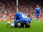 :Chelsea's French-born Senegalese striker Demba Ba celebrates after scoring the opening goal during the English Premier League football match between Liverpool and Chelsea at Anfield Stadium in Liverpool, northwest England, on April 27, 2014