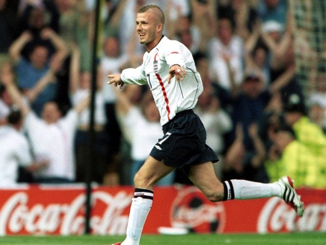 England's David Beckham celebrates scoring against Mexico on May 25, 2001.