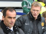 David Moyes and Roberto Martinez stand on the touchline before Everton vs. Manchester United on April 20, 2014.