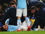 An injured David Silva of Manchester City is given treatment during the Barclays Premier League match against West Bromwich Albion on April 21, 2014
