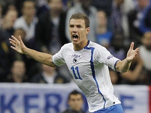 Edin Dzeko celebrates scoring for Bosnia against France on October 11, 2011.