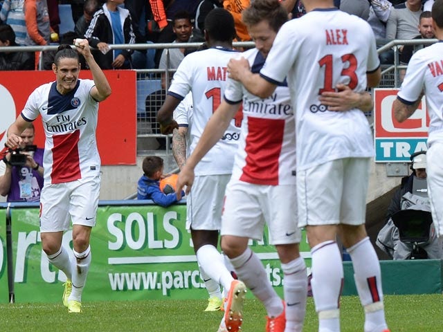 PSG's Edinson Cavani celebrates with teammates after scoring the opening goal against Sochaux during the Ligue 1 match on April 27, 2014