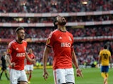 Benfica's Argentinian defender Ezequiel Garay (R) celebrates after scoring the opening goal during the UEFA Europa League semifinal first leg football match against Juventus on April 24, 2014