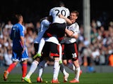 Fulham's Fernando Amorebieta is mobbed by teammates after scoring his team's second goal against Hull during the Premier League match on April 26, 2014