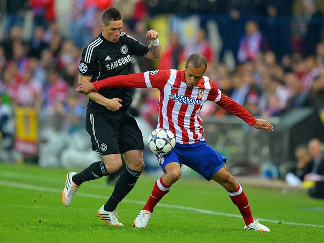 Chelsea's Fernando Torres and Atletico's Miranda in action during the Champions League semi-final first leg match on April 22, 2014