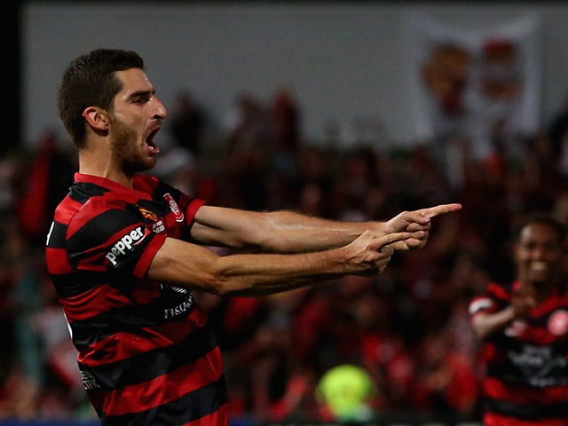 Western Sydney's Iacopo La Rocca celebrates after scoring his team's second goal against Central Coast Mariners in the A-League semi-final match on April 26, 2014