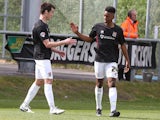 Northampton's Ivan Toney is congratulated by teammate John Marquis after scoring his team's third goal against Dagenham & Redbridge in the League Two match on April 26, 2014