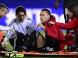 Chelsea's John Terry sits on a stretcher after picking up a foot injury during the Champions League semi-final first leg match on April 22, 2014