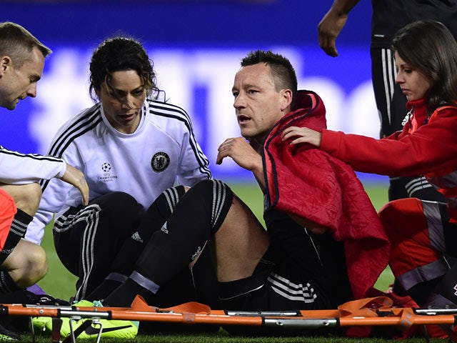 Chelsea's John Terry sits on a stretcher after picking up a foot injury during the Champions League semi-final first leg match on April 22, 2014