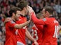 Manchester United players Juan Mata (L) and Wayne Rooney (R) celebrate after Mata scored the third goal against Norwich City at Old Trafford on April 26, 2014