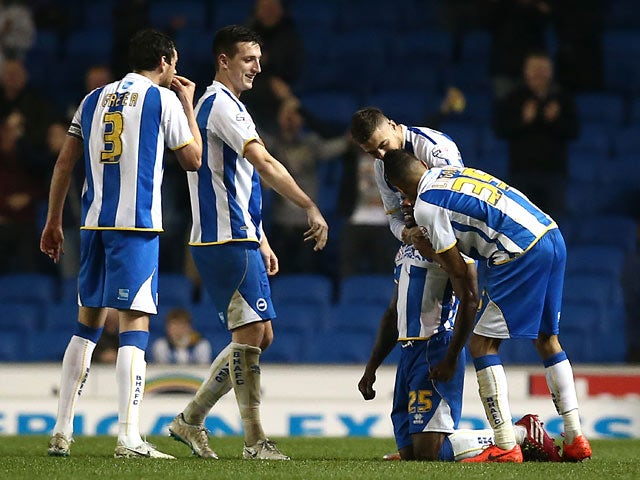 Brighton's Kazenga Lua Lua celebrates with teammates after scoring the opening goal against Yeovil during the Championship match on April 25, 2014