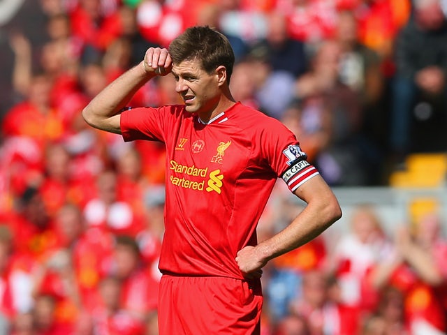 Steven Gerrard of Liverpool looks on during the Barclays Premier League match between Liverpool and Chelsea at Anfield on April 27, 2014