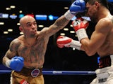Luis Collazo punches Victor Ortiz during their WBA International Welterweight title fight at Barclays Center on January 30, 2014