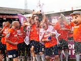 Luton Town team celebrate with the trophy following the Skrill Conference Premier match between Luton Town and Forest Green at Kenilworth Road on April 21, 2014