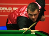 Mark Allen of Northern Ireland looks on during his match against Michael Holt of England during day four of the The Dafabet World Snooker Championship on April 22, 2014