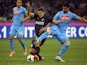 Inter Milan's Croatian midfielder Mateo Kovacic (L) fights for the ball with Napoli's Uruguayan defender Angel Miguel Britos during the Italian Seria A football match on April 26, 2014