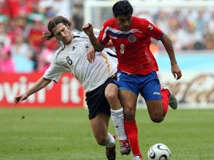 Costa Rica midfielder Mauricio Solis holds off a challenge from Torsten Frings on June 09, 2006.