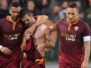 Roma make it nine in a row with Milan win