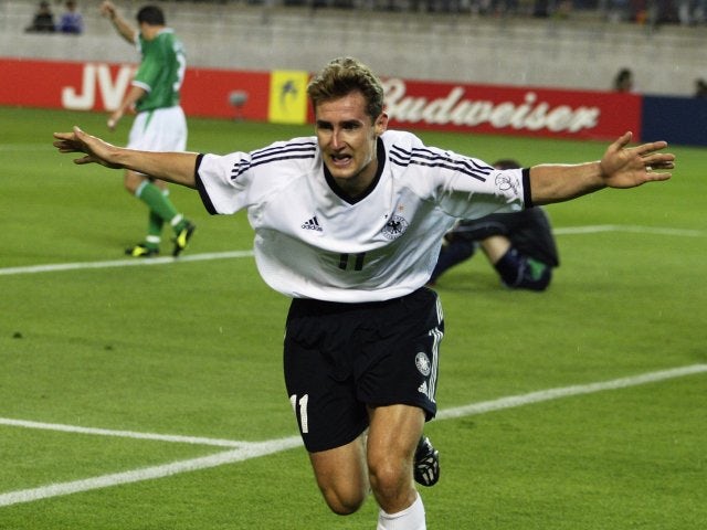 Miroslav Klose celebrates scoring for Germany against the Republic of Ireland on June 05, 2002.