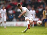 Giorgio Rasulo of MK Dons has a shot on goal during the Sky Bet League One match between MK Dons and Brentford at Stadium mk on April 21, 2014
