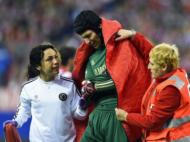 Chelsea's Petr Cech leaves the field after picking up an injury during the Champions League semi-final first leg match on April 22, 2014