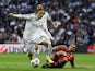 Real Madrid's Croatian midfielder Luka Modric vies with Bayern Munich's defender Philipp Lahm during the UEFA Champions League semifinal first leg at the Santiago Bernabeu stadium in Madrid on April 23, 2014
