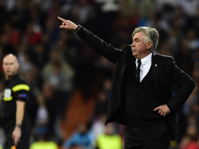 Real Madrid's Italian coach Carlo Ancelotti gestures during the UEFA Champions League semifinal first leg football match Real Madrid CF vs FC Bayern Munchen at the Santiago Bernabeu stadium in Madrid on April 23, 2014