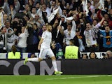 Real Madrid's French forward Karim Benzema celebrates after scoring during the UEFA Champions League semifinal first leg football match Real Madrid CF vs FC Bayern Munchen at the Santiago Bernabeu stadium in Madrid on April 23, 2014