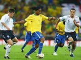 Brazil's Ronaldinho keeps possession from England defenders Nicky Shorey and John Terry on June 01, 2002.