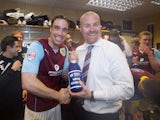 Burnley captain Michael Duff and manager Sean Dyche celebrate promotion to the Premier League on April 21, 2014