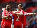 Southampton players celebrates after Everton's Seamus Coleman scored an own goal to make it 2-0 during the Premier League match on April 26, 2014