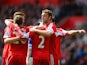 Southampton players celebrates after Everton's Seamus Coleman scored an own goal to make it 2-0 during the Premier League match on April 26, 2014