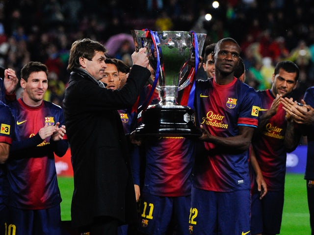 Head coach Tito Vilanova and Eric Abidal of FC Barcelona holds up the trophy during the celebration after winning the Spanish League after the La Liga match between FC Barcelona and Real Valladolid CF at Camp Nou on May 19, 2013
