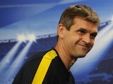 Barcelona's coach Tito Vilanova smiles as he leaves a press conference at Luz Stadium in Lisbon on October 1, 2012