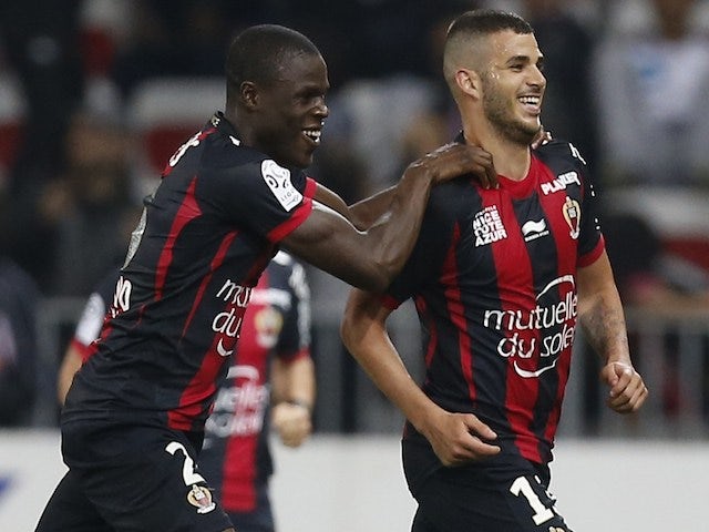 Nice's French midfielder Valentin Eysseric (R) celebrates after scoring a goal during the French L1 football match between OGC Nice and Stade de Reims, on April 26, 2014 
