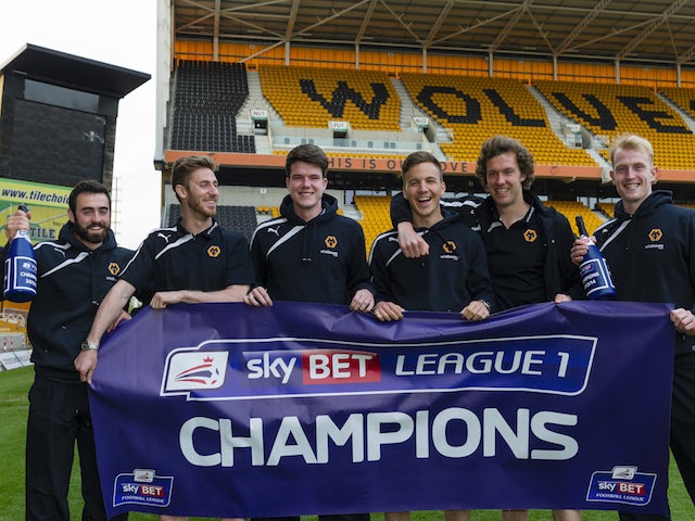 Wolves players celebrate after winning the League One title on April 21, 2014