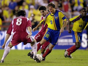 Ecuador captain Alex Aguinaga dribbles with the ball on June 22, 2002.