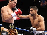 Danny Garcia from Philadelphia, Pennsylvania, takes a right from Amir Khan, R,from Bolton, England on July 14, 2012