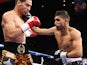 Danny Garcia from Philadelphia, Pennsylvania, takes a right from Amir Khan, R,from Bolton, England on July 14, 2012